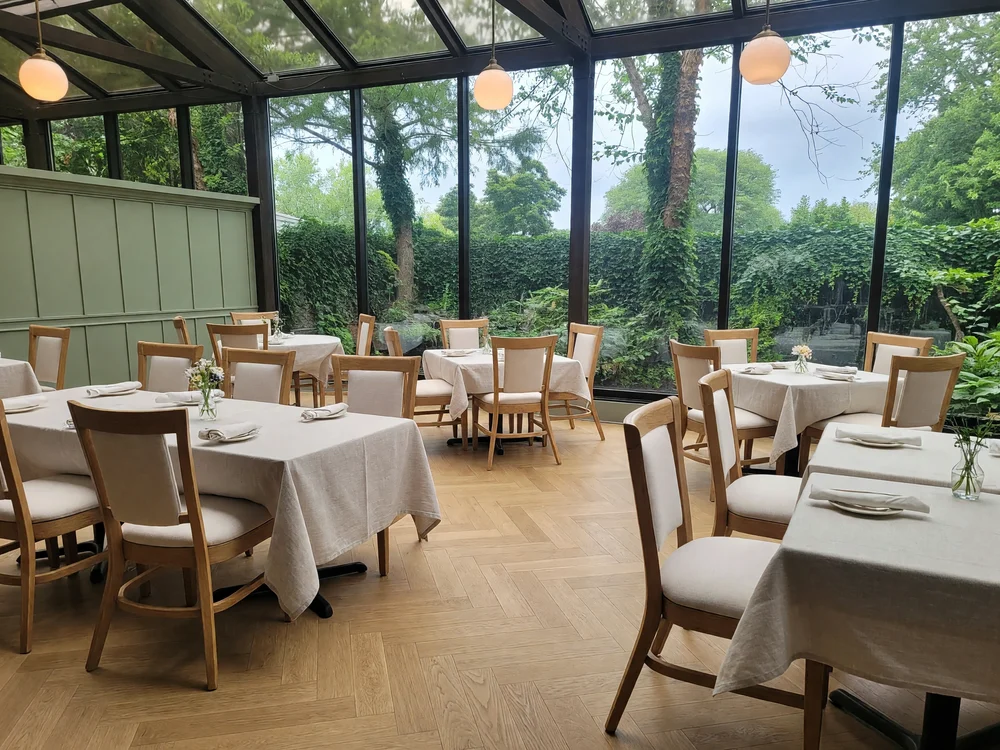Grok Imagine Image AI-edited Conservatory restaurant